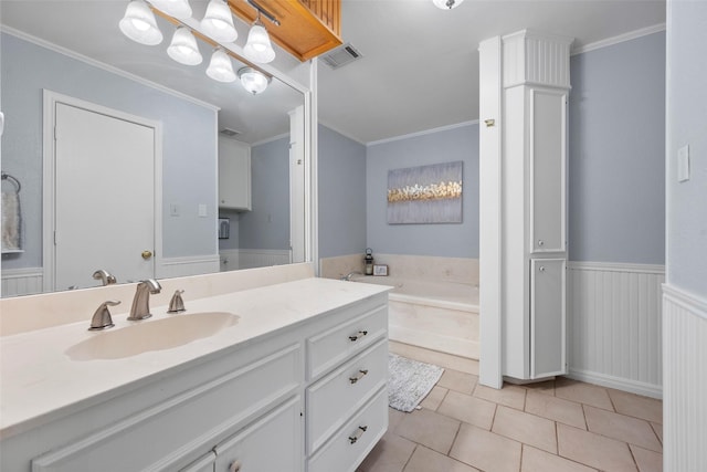 bathroom with vanity, a bathtub, crown molding, and tile patterned floors