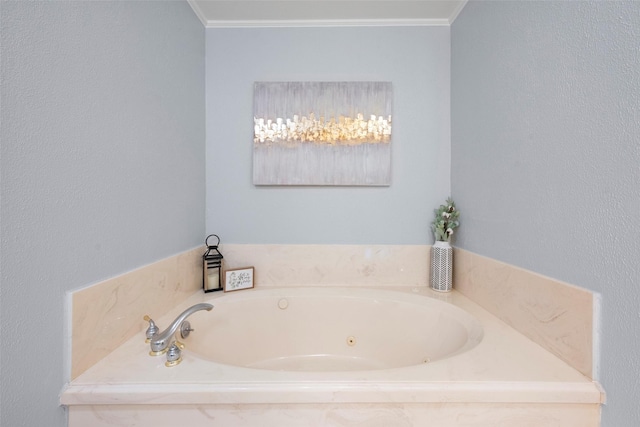 bathroom with crown molding and a relaxing tiled tub