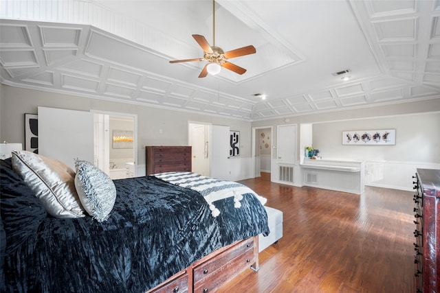 bedroom featuring connected bathroom and dark hardwood / wood-style floors