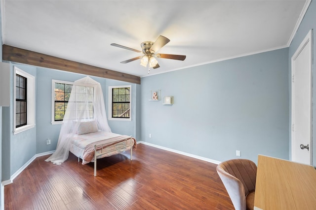 bedroom featuring crown molding, dark hardwood / wood-style floors, and ceiling fan