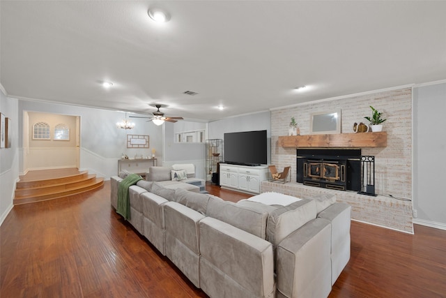 living room with crown molding, ceiling fan, and dark hardwood / wood-style flooring