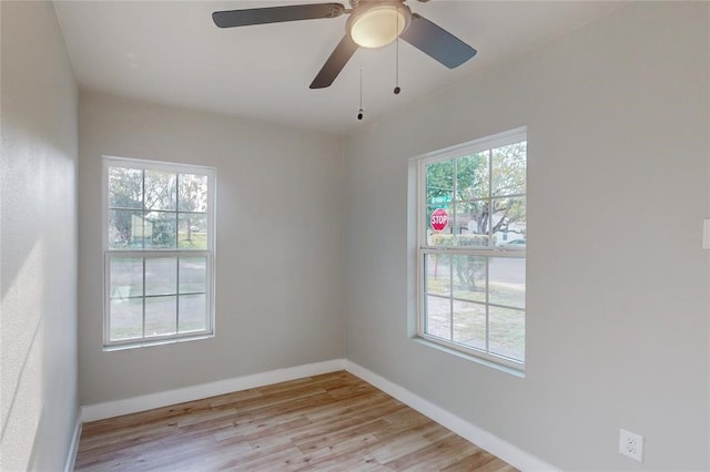 unfurnished room featuring a healthy amount of sunlight and light wood-type flooring