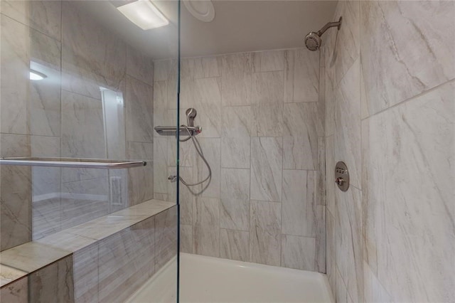 bathroom featuring tiled shower