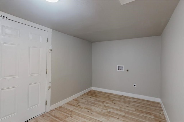 clothes washing area featuring hookup for a washing machine, hookup for an electric dryer, and light hardwood / wood-style floors