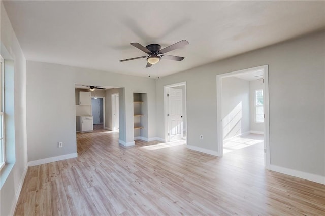 unfurnished room featuring ceiling fan and light wood-type flooring