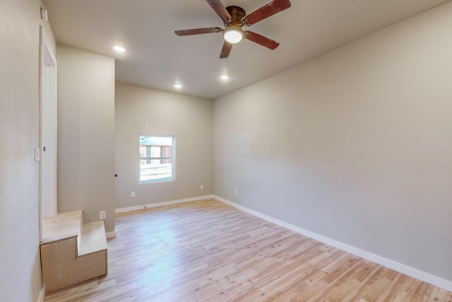 spare room featuring ceiling fan and light wood-type flooring