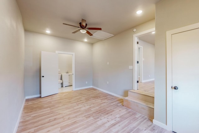 empty room featuring ceiling fan and light wood-type flooring