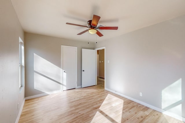 spare room with ceiling fan and light hardwood / wood-style floors