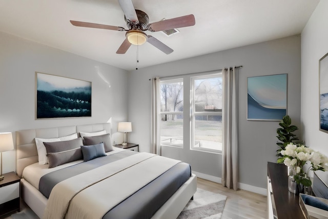 bedroom featuring ceiling fan and light hardwood / wood-style flooring