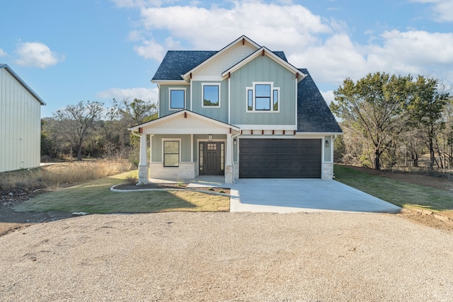 craftsman-style home with covered porch and a garage