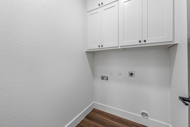 clothes washing area with gas dryer hookup, cabinets, hookup for a washing machine, dark wood-type flooring, and hookup for an electric dryer