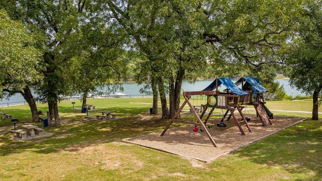 view of jungle gym with a water view and a yard