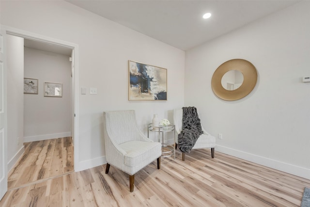 sitting room with light wood-type flooring