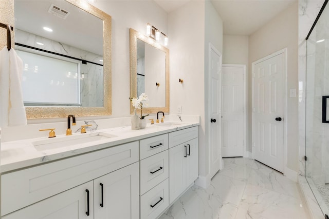 bathroom featuring an enclosed shower and vanity