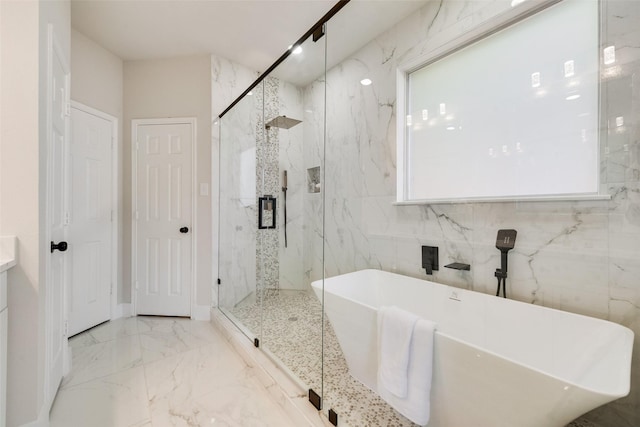 bathroom featuring separate shower and tub