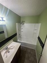 bathroom featuring bathing tub / shower combination and vanity