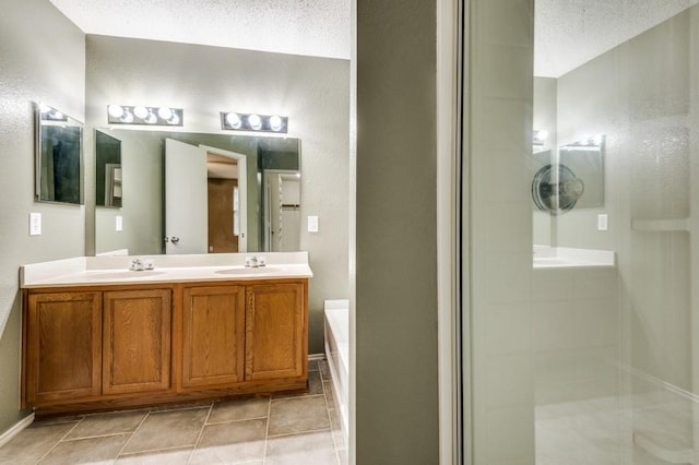 bathroom with tile patterned floors, independent shower and bath, and vanity