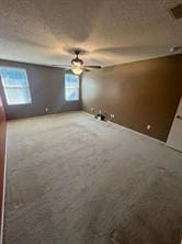 interior space featuring carpet and ceiling fan