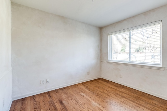 spare room featuring light wood-type flooring