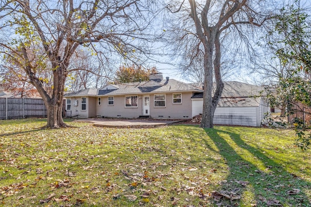 rear view of property with a lawn