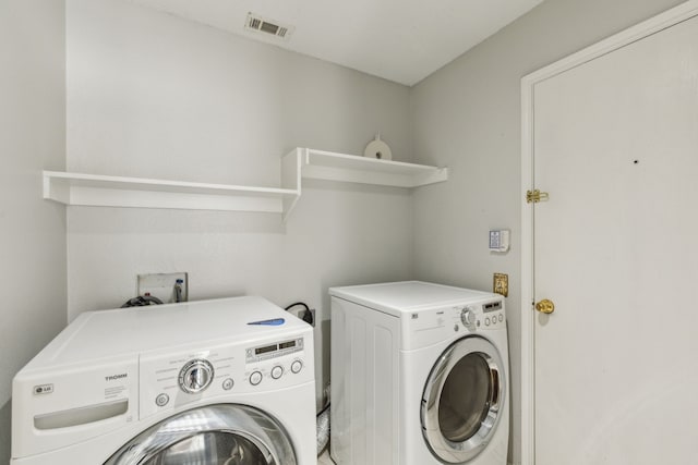 washroom featuring separate washer and dryer