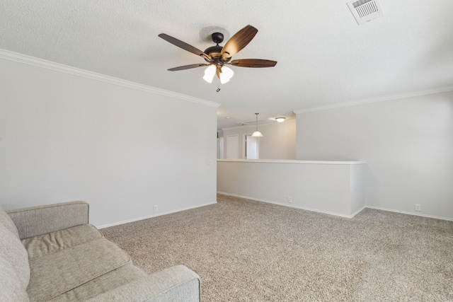 sitting room featuring carpet flooring, ceiling fan, a textured ceiling, and ornamental molding