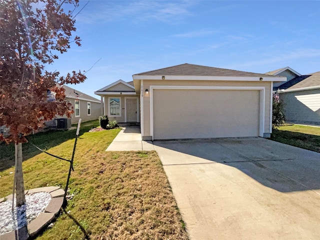 view of front of home featuring a front lawn, central AC unit, and a garage