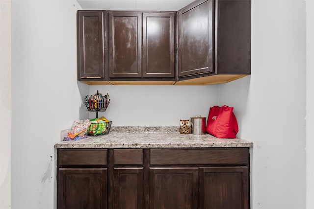 bar with dark brown cabinets