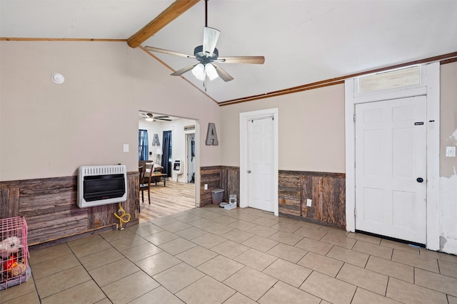 tiled foyer featuring lofted ceiling with beams, ceiling fan, ornamental molding, and heating unit