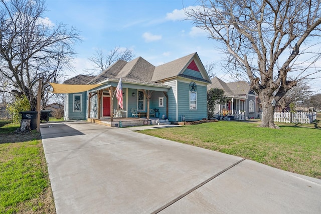 bungalow with a front lawn and a porch