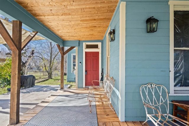 doorway to property featuring a porch