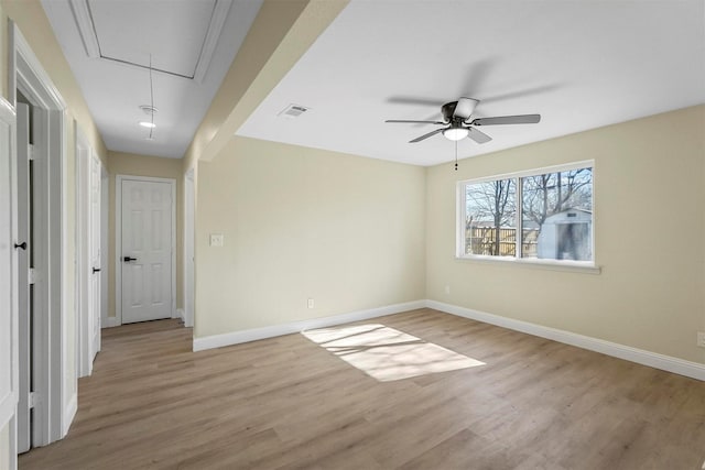 empty room featuring ceiling fan and light hardwood / wood-style flooring