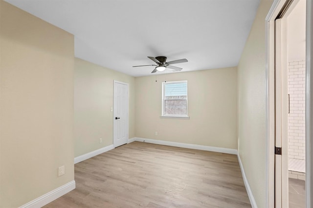 unfurnished room featuring ceiling fan and light wood-type flooring