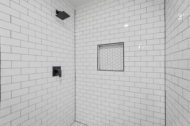 bathroom featuring a tile shower