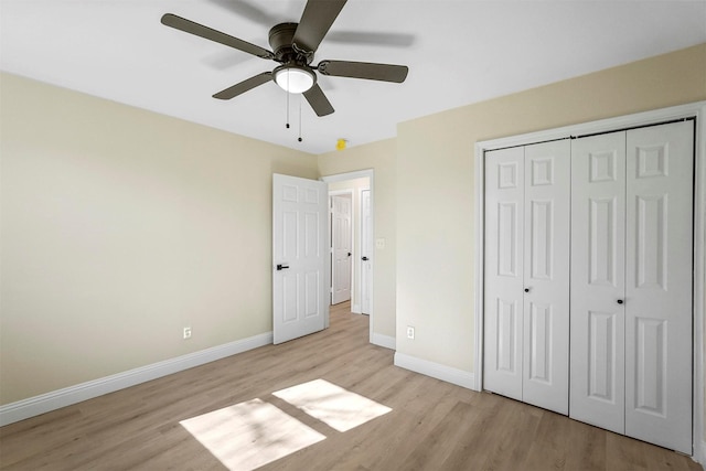 unfurnished bedroom with ceiling fan, light hardwood / wood-style floors, and a closet