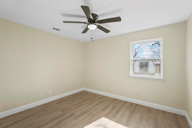 empty room with ceiling fan and light wood-type flooring