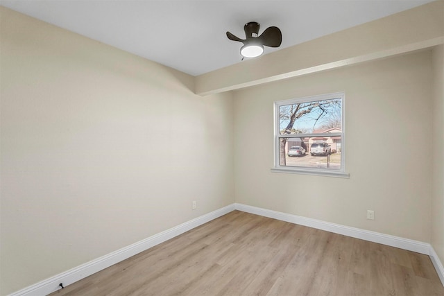 empty room featuring ceiling fan and light hardwood / wood-style floors