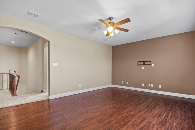 empty room featuring dark hardwood / wood-style floors and ceiling fan