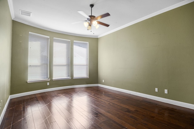 spare room with ornamental molding, dark hardwood / wood-style floors, and ceiling fan