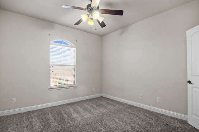 empty room with ceiling fan and carpet flooring