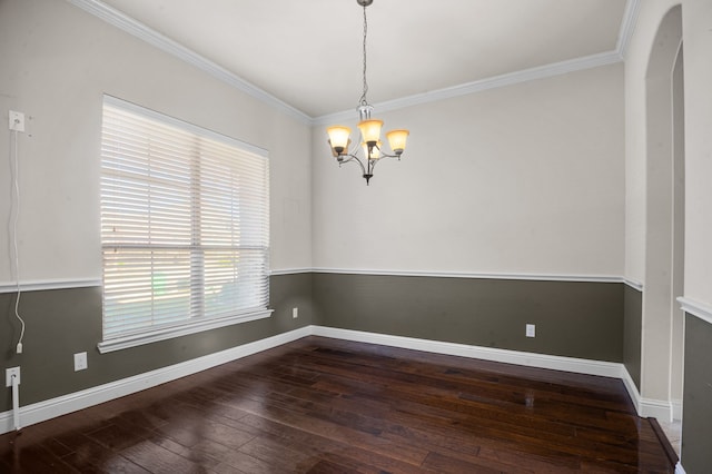 unfurnished room featuring crown molding, a chandelier, and dark hardwood / wood-style floors