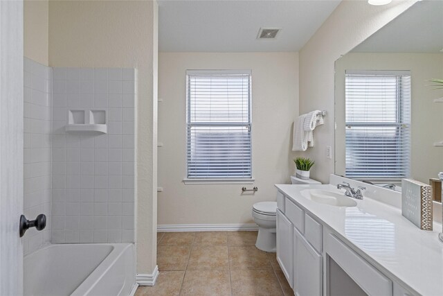 full bathroom featuring tile patterned flooring, vanity, toilet, and shower / bathtub combination