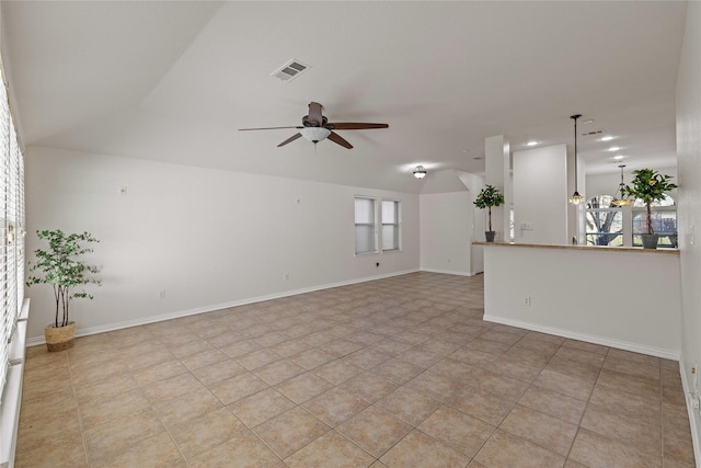 unfurnished living room featuring ceiling fan and light tile patterned floors