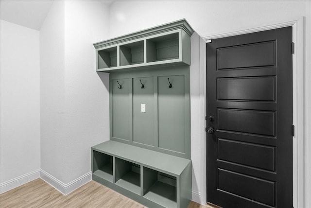 mudroom with baseboards and light wood finished floors