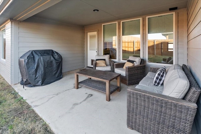 view of patio featuring an outdoor living space and a grill