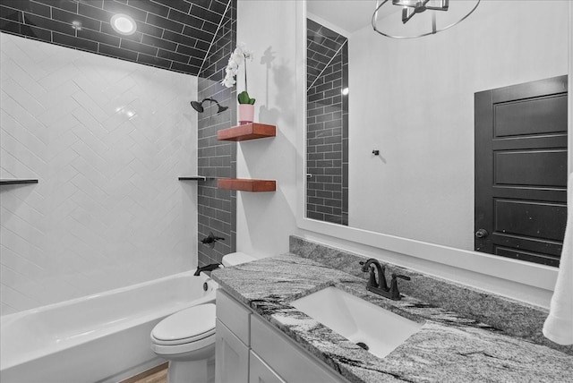 full bath featuring toilet, vanity, and  shower combination