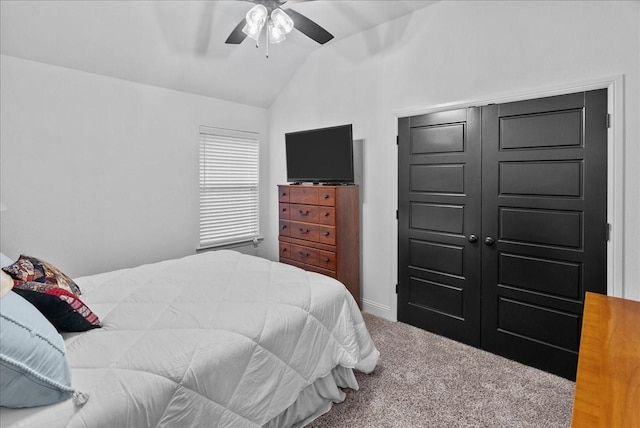 bedroom with vaulted ceiling, ceiling fan, and carpet floors