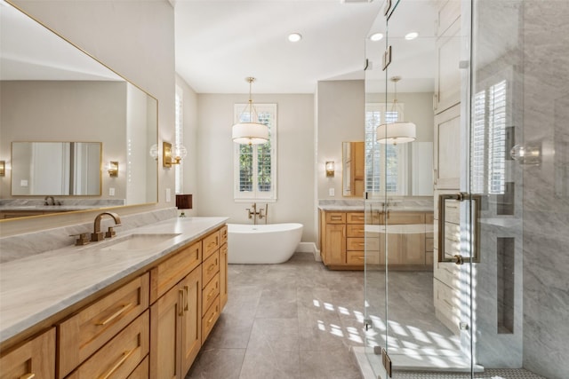 bathroom featuring tile patterned flooring, vanity, and independent shower and bath