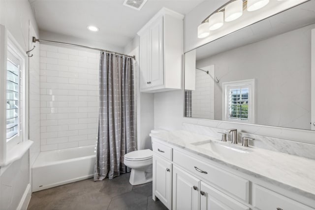 full bathroom featuring shower / bath combination with curtain, toilet, and vanity