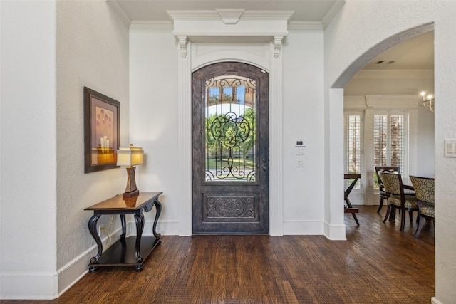 entrance foyer featuring dark hardwood / wood-style flooring and ornamental molding